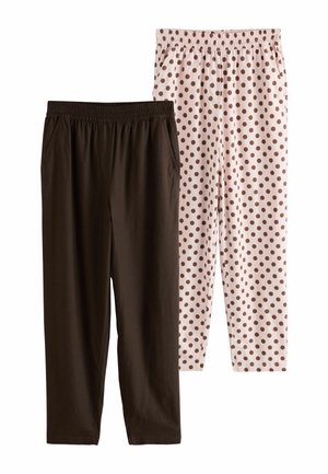 Two pairs of elastic waist pants, one solid dark brown, the other light beige with brown polka dots, displayed side by side.