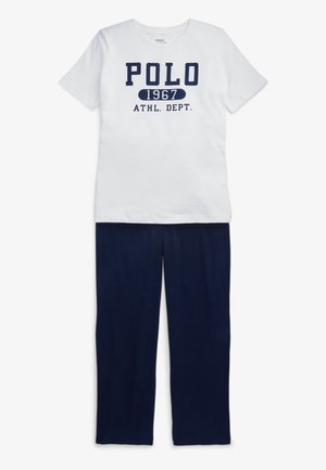 White cotton T-shirt with navy text "POLO 1967 ATHL. DEPT." paired with navy jersey pants. Simple design, casual fit.