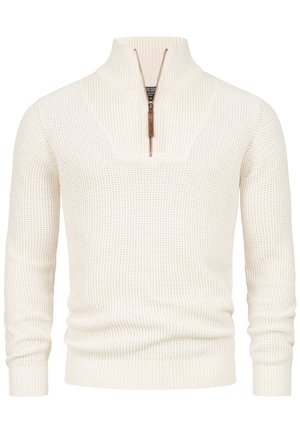 Cremfarbener Strickpullover mit einem Halb-Reißverschlusskragen, gerippter Textur und engen Bündchen. Der Stoff hat ein Waffelgewebe-Muster.