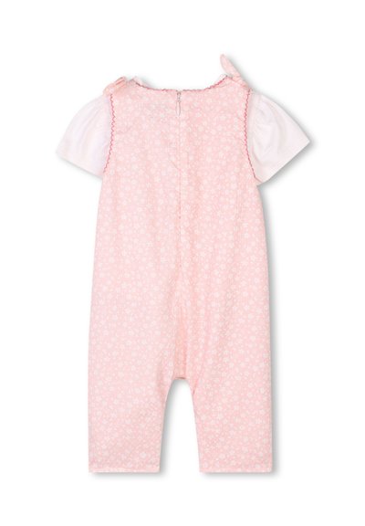 Giocattolo rosa con motivo floreale bianco, maniche corte, bordi scallop e chiusura con zip sul retro. Tessuto morbido, vestibilità ampia e design giocoso.