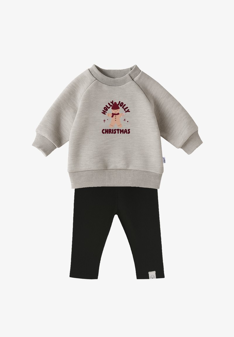 Light gray sweatshirt with "Holly Jolly Christmas" print and a reindeer design; paired with black ribbed leggings.