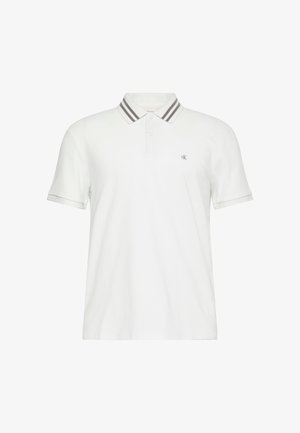 Polo bianca in misto cotone, con patta a due bottoni e colletto a righe grigie. Presenta il logo sul petto a sinistra. Maniche corte.