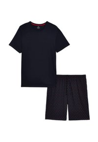 Marineblaue Baumwoll-T-Shirt mit Rundhalsausschnitt, kombiniert mit marineblauen Shorts, die ein rotes Herzmuster aufweisen und einen verstellbaren Kordelzug in der Taille haben.