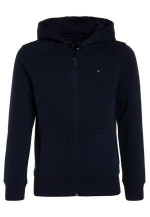 Haut à capuche zippé bleu marine, fabriqué en tissu doux, doté d'une capuche avec cordon de serrage, de poches avant et de manches côtelées pour un ajustement confortable.