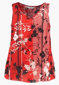 Haut rouge sans manches avec des motifs floraux en noir et blanc. Présente un décolleté en V et une texture légère et lisse.