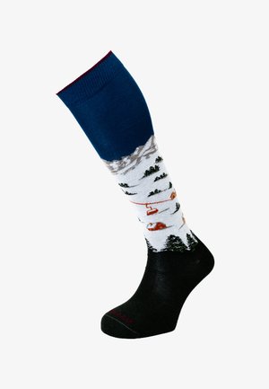 Calzino fino al ginocchio con paesaggio montano, sciovie, alberi innevati e baite, con polsino blu navy e area del piede nera.