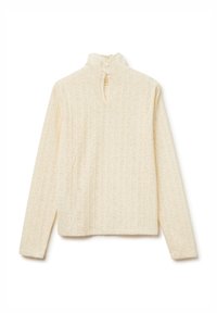 Pullover color crema con colletto alto, motivo floreale a trama, e chiusura a tre bottoni sul retro. Maniche lunghe, vestibilità ampia.