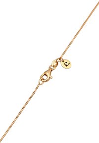 Guldtonet kædehalssmykke med en lobster clasp og en lille cirkulær charme med et minimalistisk design. Kæden har en delikat, tekstureret finish.