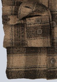 Brown and black plaid shirt made of textured fabric, featuring four dark buttons and a folded collar, with a visible pocket detail.