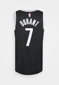 Černý basketbalový dres s bílými detaily, na zadní straně s nápisem "DURANT" a číslem "7", vyrobený z prodyšného síťovaného materiálu.