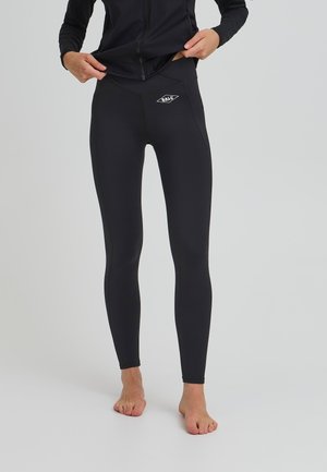Black leggings made of stretchy material, featuring a high waistband, slim fit, and a small white logo on the left thigh.