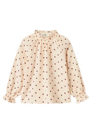 Lichtroze blouse met kleine rode bloemenprint. Heeft een gegatherde halslijn en elastische boorden aan de lange mouwen. Textuur stof.