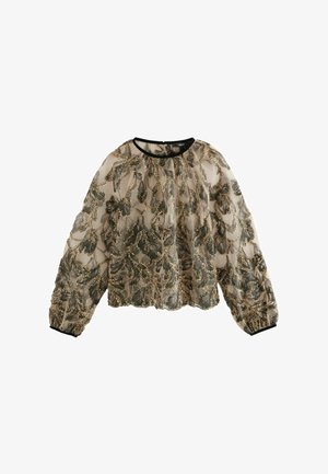 Blusa transparente en crema con patrón de hojas en verde y dorado. Mangas abullonadas, escote redondeado y ribete negro en el dobladillo y los puños. Tejido texturizado.