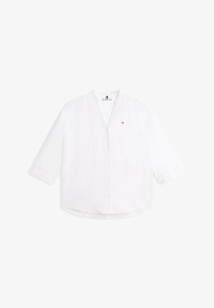 Biała koszula na guziki z długim rękawem, kołnierzykiem typu stójka i małym logo Tommy Hilfiger na lewej piersi.