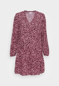 Robe marron avec un décolleté en V, des manches longues et un ourlet évasé, ornée de de petites fleurs roses tout au long. Tissu léger.