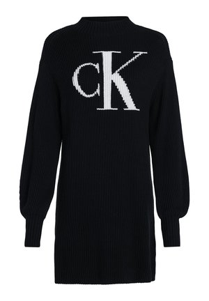 Robe en maille noire à manches longues avec une texture côtelée et un grand logo blanc "cK" centré sur la poitrine.
