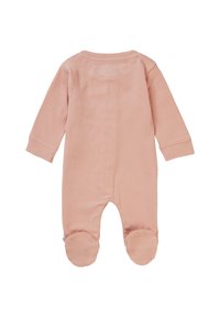 Combinaison pour bébé rose clair en tissu côtelé, avec des manches longues, un col rond et des couvre-pieds circulaires. Texture lisse, design simple.