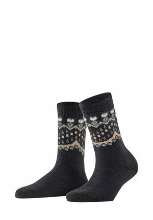 Dark gray socks with patterns in white and beige, featuring geometric shapes and snowflake designs, made from a textured knit material.