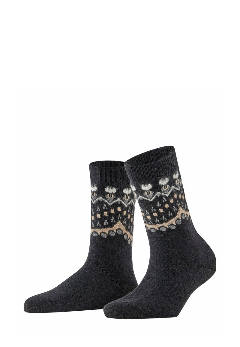 Dunkelgraue Socken mit Mustern in Weiß und Beige, die geometrische Formen und Schneeflockenmuster aufweisen und aus einem strukturierten Strickmaterial gefertigt sind.