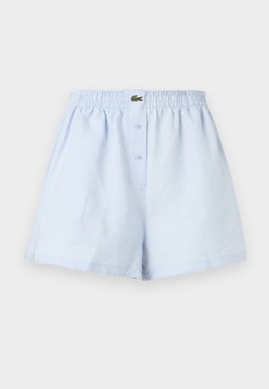 Boxer homme bleu clair avec ceinture élastique, fermeture avant à boutons et petit logo crocodile vert au centre.