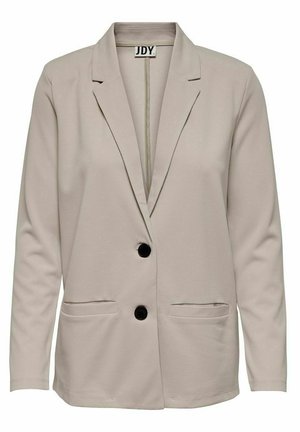 Blazer beige clair en tissu extensible, avec un col cranté, deux poches avant et deux boutons noirs sur le devant.