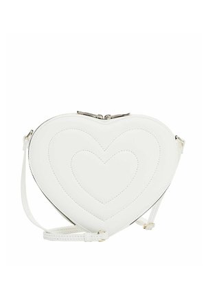 White heart-shaped crossbody bag with stitched heart patterns and adjustable strap on a white background.