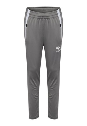 Pantalons de sport gris avec une taille élastique, coupe slim, rayures blanches sur les côtés, poches zippées noires et un logo sur la jambe inférieure.
