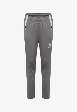 Grijze sportbroek met een elastische tailleband, slim fit, witte zijkanten, zwarte ritszakken en een logo op de onderkant van het been.