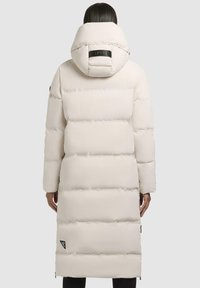 Long, puffy white coat with a hood, featuring horizontal quilted sections, a branded back tab, and a side logo accent.