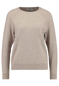 Beige stickad tröja med rund halsringning, ribbade muddar och nederkant, samt raglanärmar. Tillverkad av mjukt tyg som ger en slät yta.