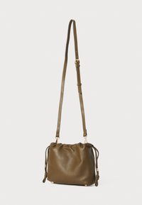 Olive green leather crossbody bag with adjustable strap and drawstring side details on a white background.