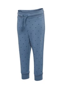 Blaue Baumwoll-Jogginghosen mit einem elastischen Bund und Kordelzug. Verziert mit einem dezenten Muster aus kleinen geometrischen Formen. Enganliegende Bündchen.