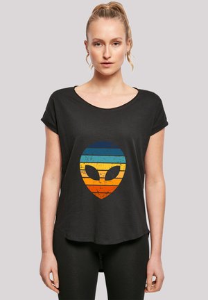 Black short-sleeved t-shirt featuring a large, distressed alien head graphic with horizontal stripes in blue, orange, and yellow.