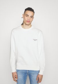 Calvin Klein Jeans FLOWER LOGO RELAXED CREW NECK - Sweatshirt - bright white