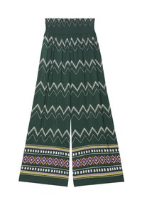Wide-leg trousers made of green fabric featuring a zigzag white print, with colorful geometric patterns at the hem. Elastic waistband.