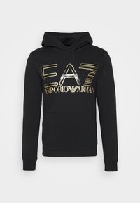 Svart hoodie i bomull med en stor metallisk guld- och silverfärgad "EAT EMPORIO ARMANI"-logotyp på framsidan och en känguruficka.