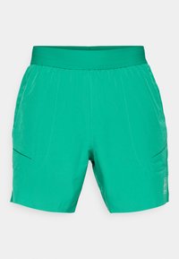 Grüne Shorts aus leichtem Stoff, mit einem elastischen Bund, zwei Seitentaschen und dezenten Nähdetails.