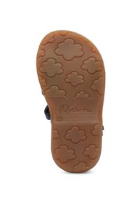 Hnědá gumová podešev se vzory ve tvaru květin, označená "Naturino" a velikostí "20." Povrch je hladký s mírným leskem.