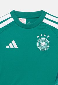 Green Adidas soccer jersey featuring white stripes, a round neck, and the German Football Association emblem with four stars above it.