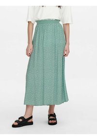 Grøn maxi-nederdel med blomsterprint, elastisk talje og blødt stof, prydet med små blomster og en let, A-linjeformet silhuet.