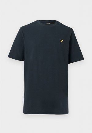 Camiseta de manga corta texturizada azul marino con cuello redondo y pequeño logo de pájaro dorado en el pecho izquierdo.