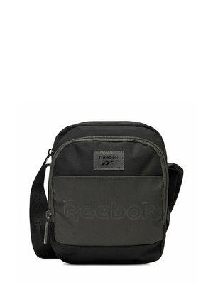 Kompaktowa czarna i ciemnoszara torba na ramię Reebok z przednią kieszenią na zamek, wytłoczonym logo oraz regulowanym paskiem.
