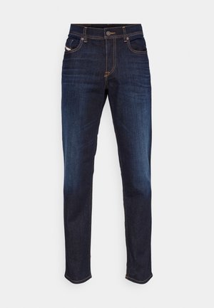 Dark blue denim jeans with a straight cut, five pockets, and contrasting orange stitching along the seams. Smooth texture and minimal design details.