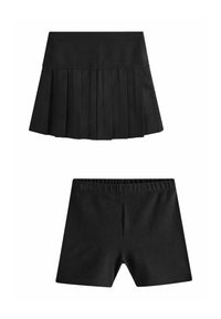 Falda negra plisada con shorts ajustados incorporados debajo, diseñada para comodidad y uso activo.