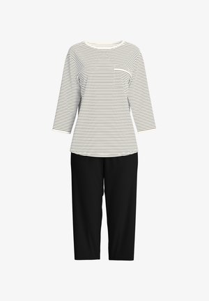 Haut rayé à manches longues, blanc et noir, avec un col rond et une poche poitrine, associé à un pantalon noir ample et court.