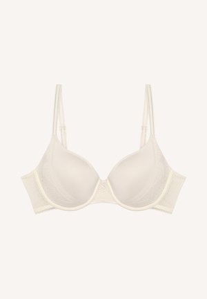 Unterstützender Bügel-BH in hellem Creme mit glatten, vorgeformten Cups, Spitze-Details und verstellbaren Trägern; ausgestattet mit einem strukturierten Seitenband für zusätzlichen Halt.