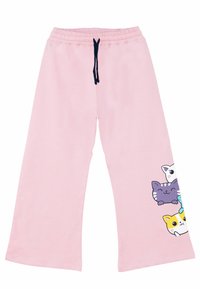 Rosa Jogginghose mit elastischem Bund und marineblauem Kordelzug. Sie hat einen Cartoon-Druck mit vier bunten Katzenköpfen auf dem linken Bein.