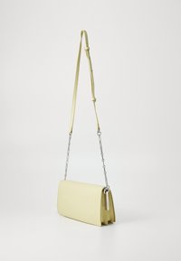 Yellow leather shoulder bag with a rectangular shape, a long adjustable strap, and a silver chain accent. Smooth texture, minimal design.
