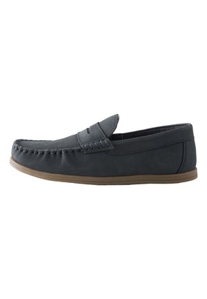 Mørkegrå læderslip-on loafer med syninger og en lys brun flad gummisål.
