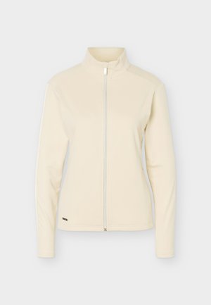 Μπεζ μπουφάν με μακριά μανίκια, ψηλό γιακά και φερμουάρ μπροστά, εμφανίζεται σε ουδέτερο φόντο.